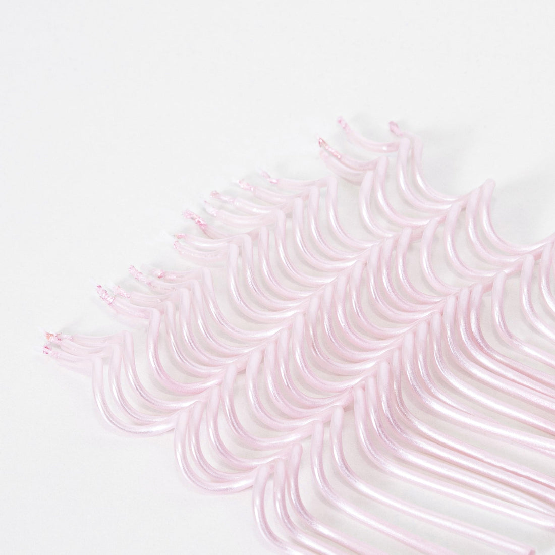 A pack of 20 Meri Meri Pink Swirly Candles.
