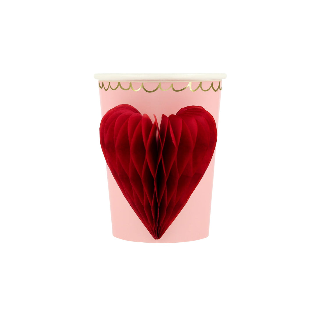 A vintage pink paper cup with a Honeycomb Heart Cup from Meri Meri on it.