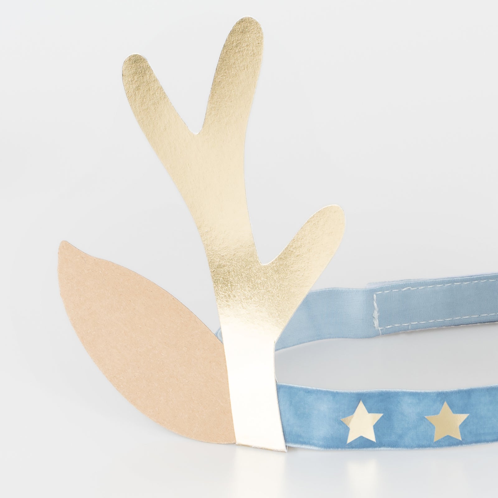 Close up of reindeer antler headband with blue band.