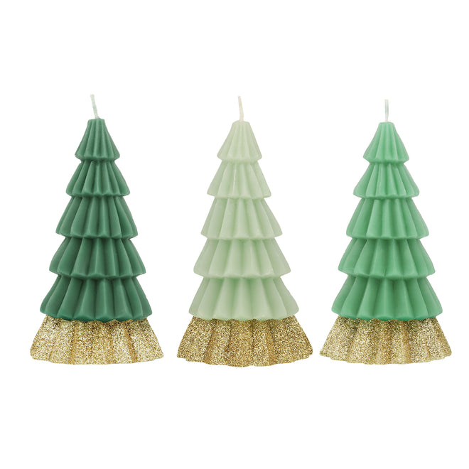 A set of three Christmas tree-shaped candles in green, dark green, and mint colors with a gold glitter base.