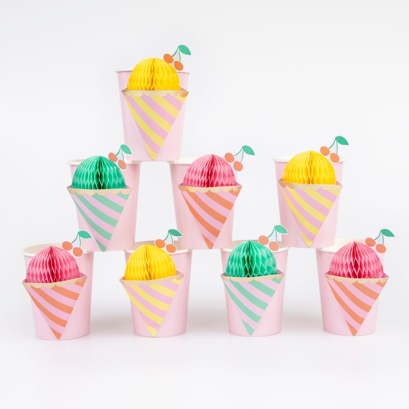 Meri Meri Ice Cream Cup set. Each set includes 3 different color combinations, 2 x mint and pink, 3 x yellow and pink and 3 x coral and pink with honeycomb ice cream details, to be held open with the double-sided tape supplied.
