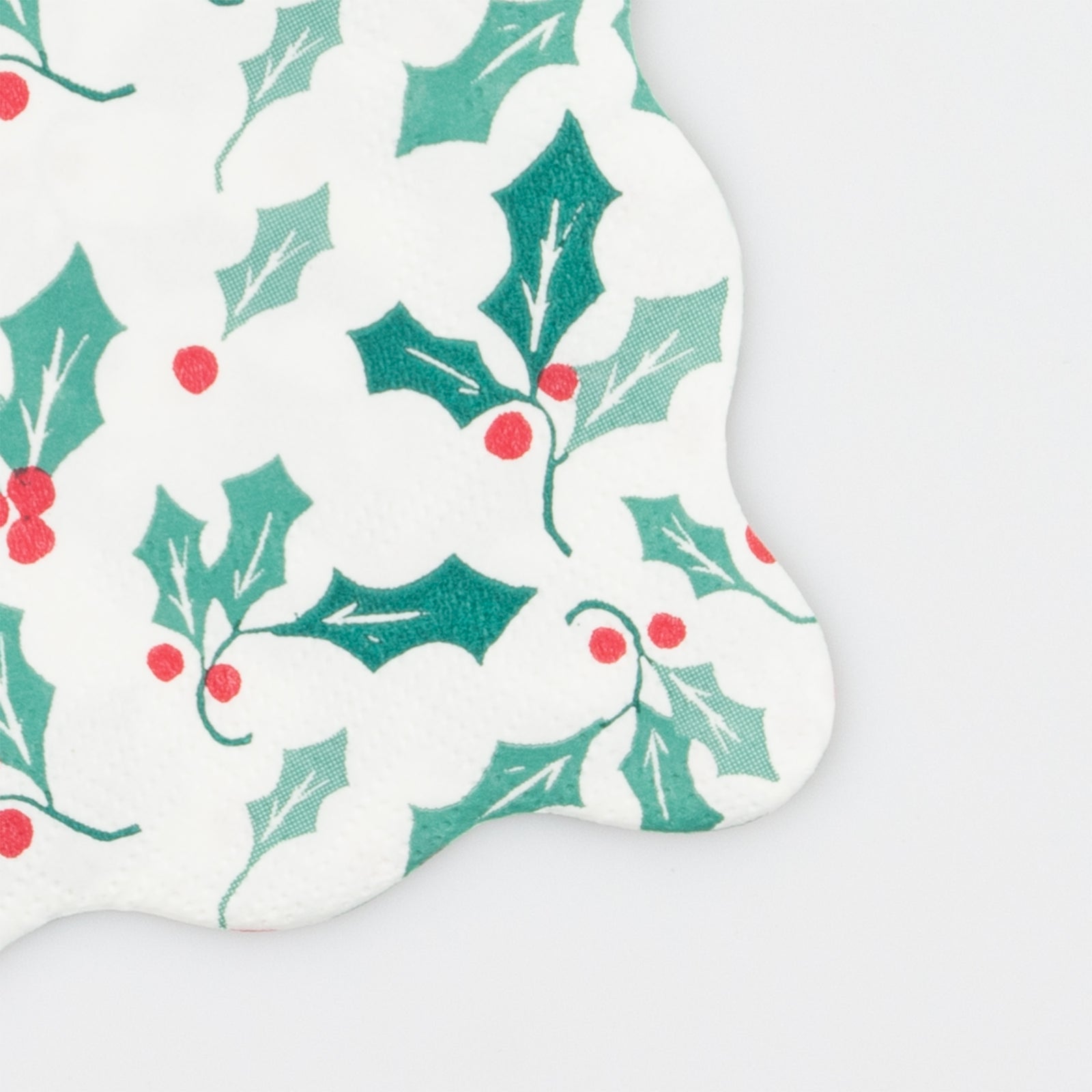 Close up of the napkin showing the holly design.