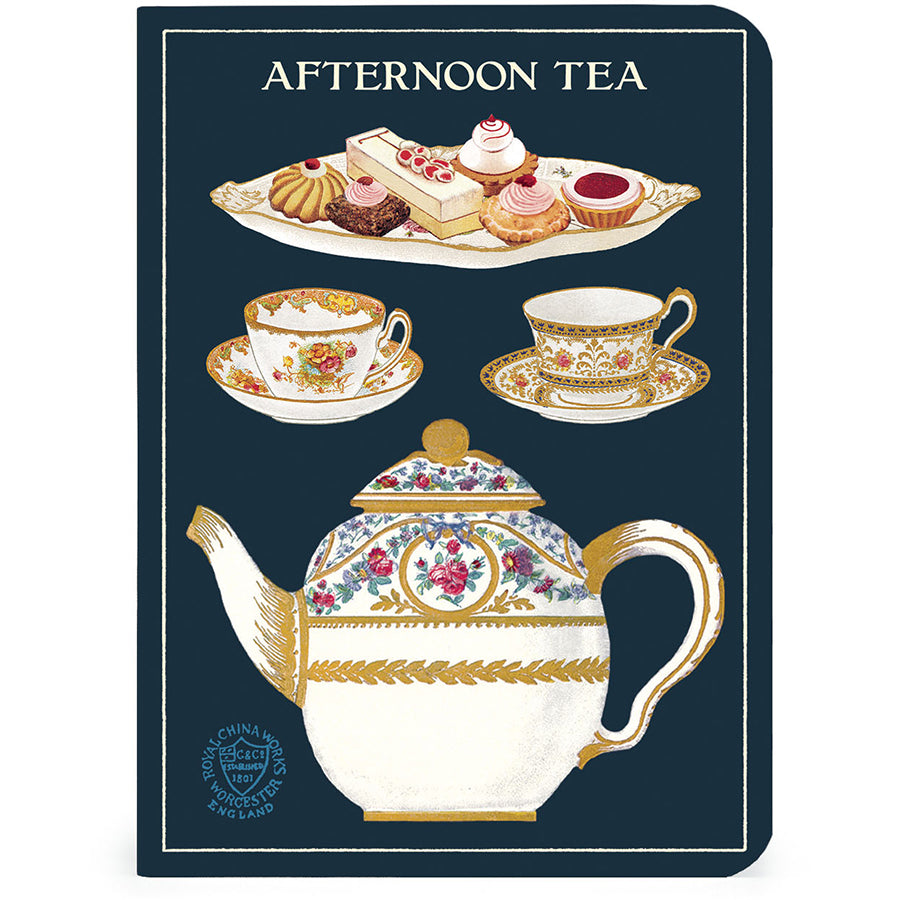 Notebook cover with afternoon tea design featuring teacups, a teapot, and pastries on a dark blue background.