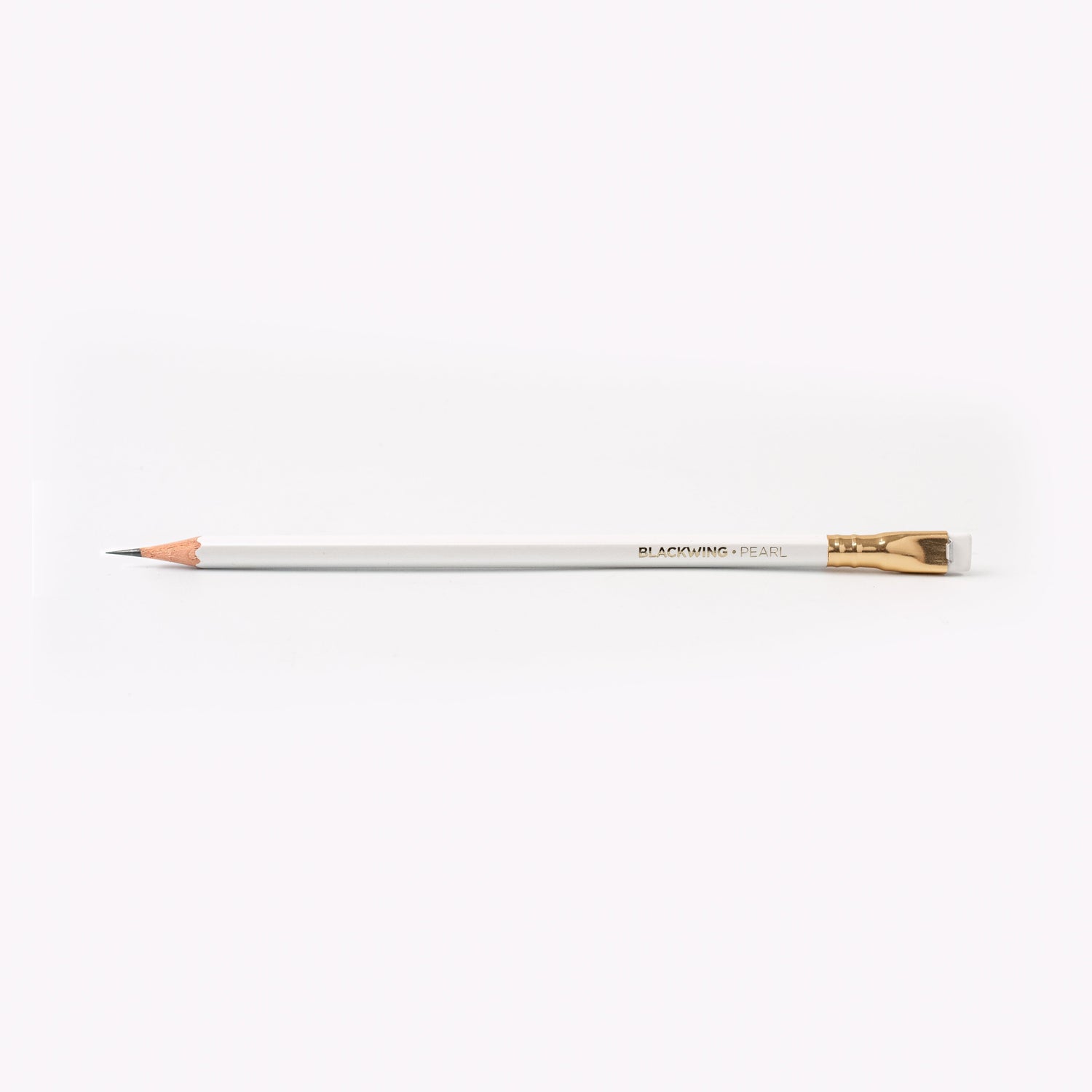 A Blackwing Pearl Pencils Set of 12 with a graphite core and white eraser next to its packaging box on a white background.