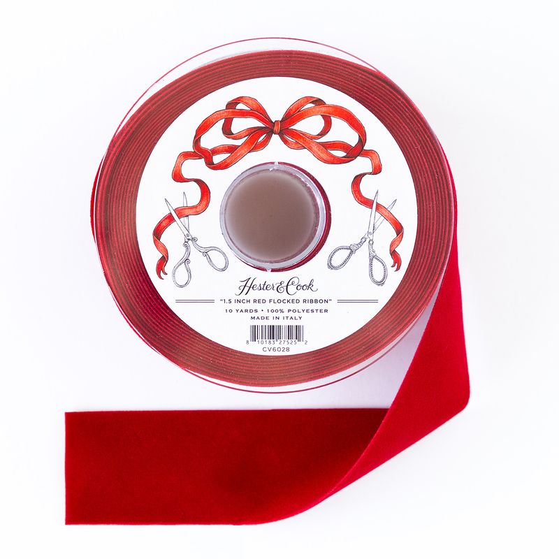 A spool of 1.5-inch wide red flocked ribbon by Hester & Cook on a white background.
