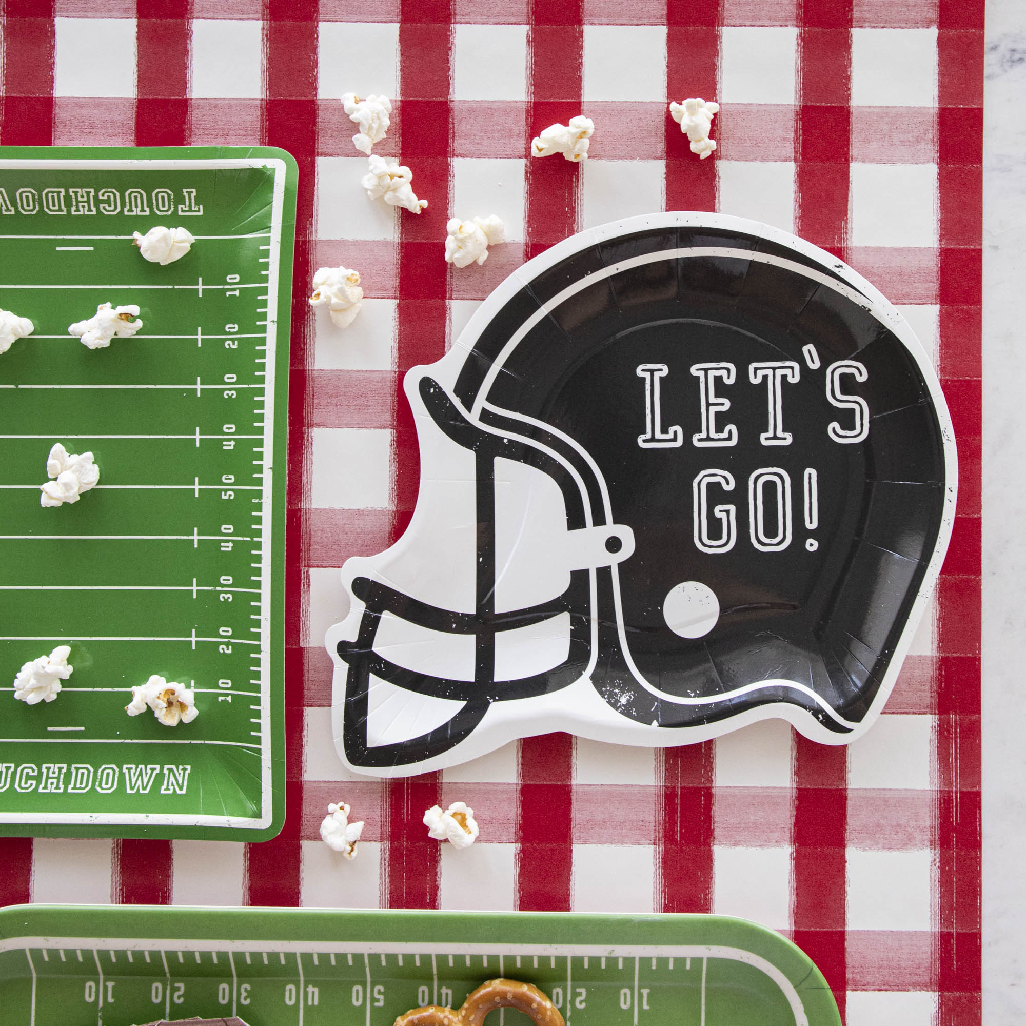 Football helmet paper plates with the words "LET&