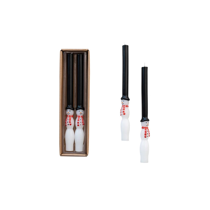 Four Snowman candles, two in package and two out of package.