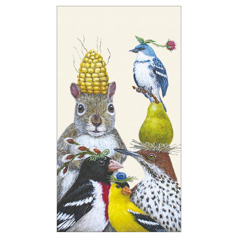 An illustration of a stack of wildlife with food items on their heads: a squirrel with a corn cob, birds with fruit and flowers, and a woodpecker with cherries, featured on &quot;Paper Products Design Party Under the Feeder Guest Towel.