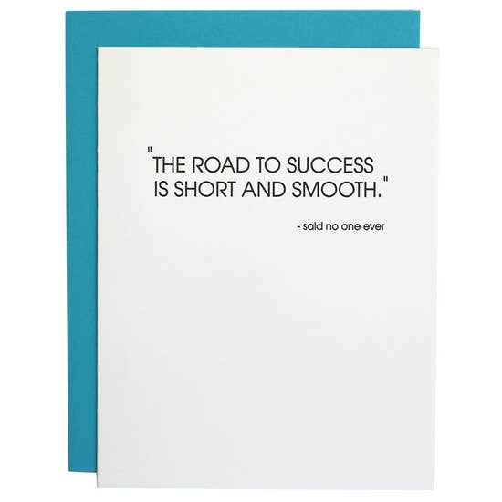 A Chez Gagne Road to Success Letterpress Card with a humorous quote saying, &quot;the road to success is short and smooth.&quot; - said no one ever, enclosed in a neon blue envelope.