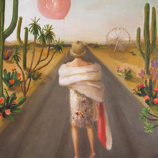 A framed surrealist painting by fine artist Janet Hill of a person standing in a desert landscape with cacti and a small ferris wheel, gazing at a floating pink balloon. Janet Hill&