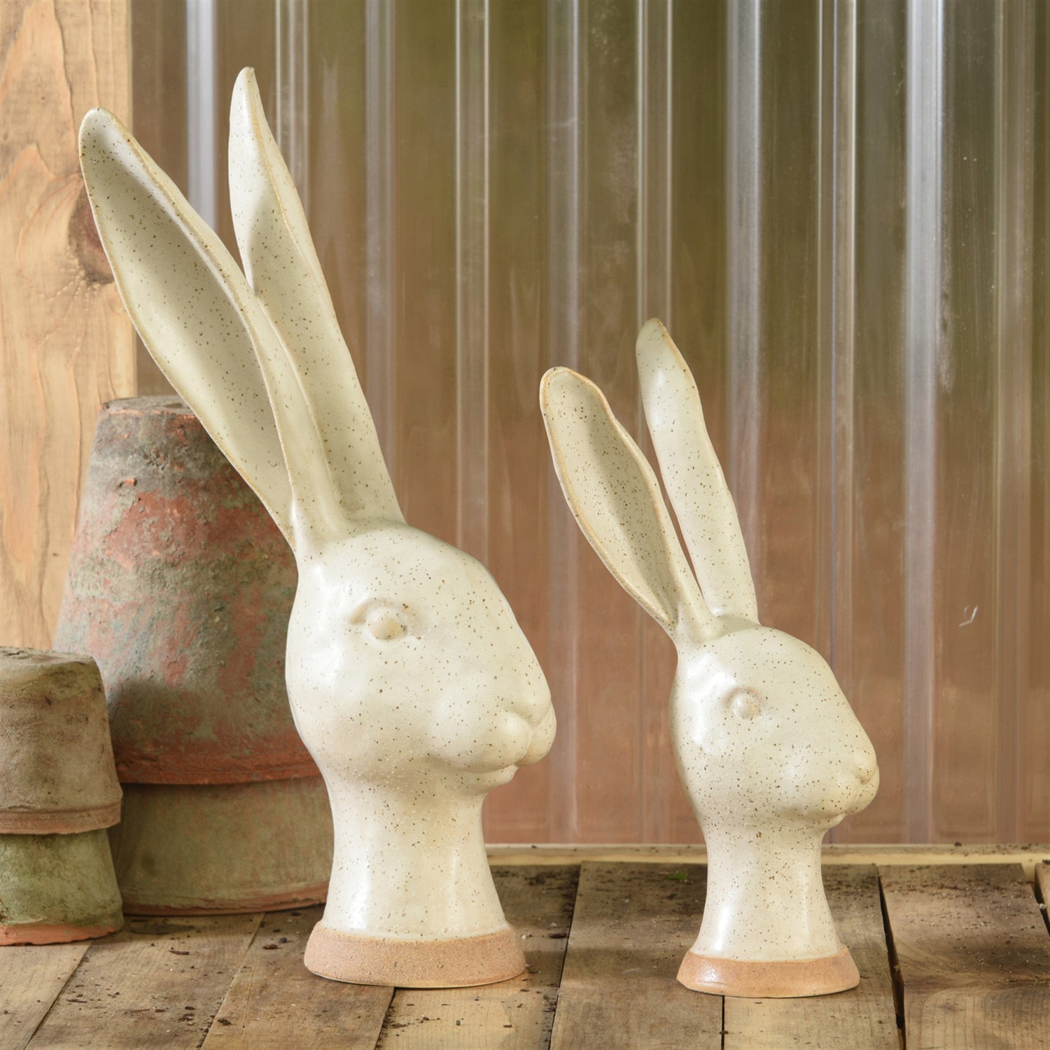 An enchanting group of HomArt Matte White Ceramic Hares, perfect as a garden decoration.