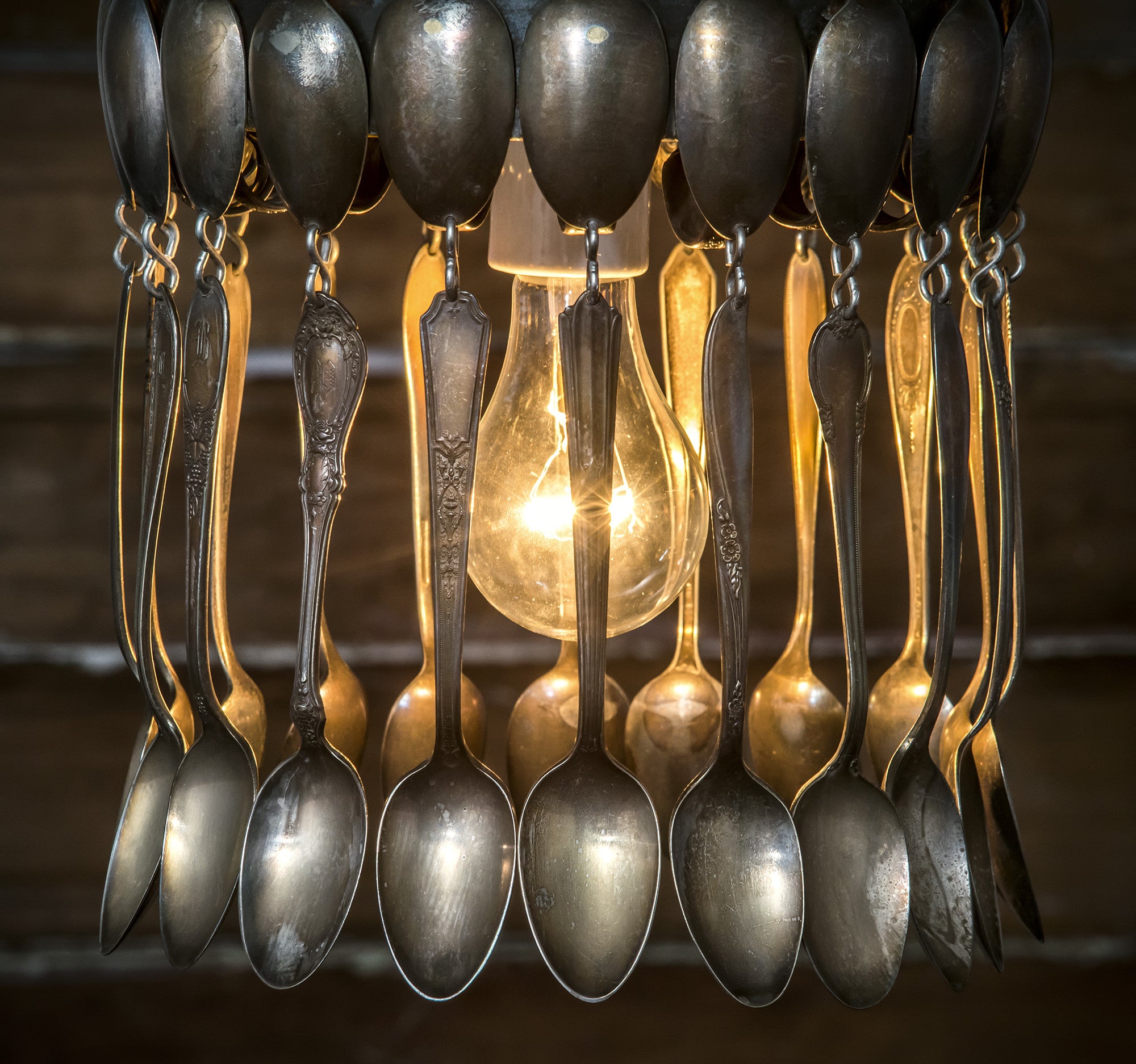 A hand-crafted Spoon Pendant Light made of vintage spoons hanging from a chain by Hester & Cook.