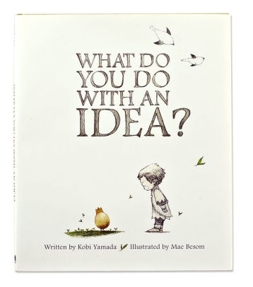 A cover of the Compendium award-winning book titled &quot;What Do You Do With an Idea?&quot; written by Kobi Yamada and illustrated by Mae Besom, featuring an illustration of a child looking at a golden
