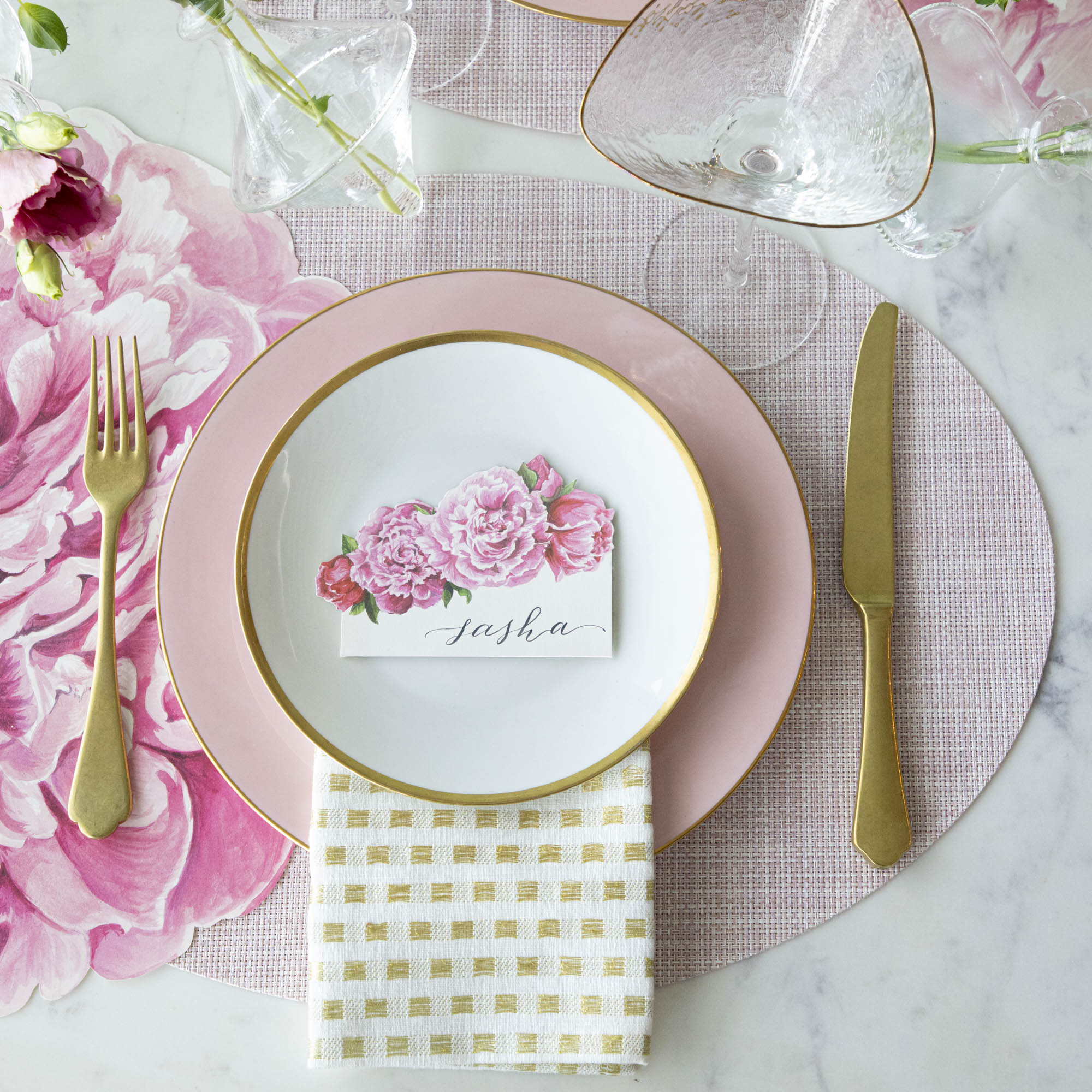 The Die-cut Peony Placemat under an elegant floral place setting, from above.