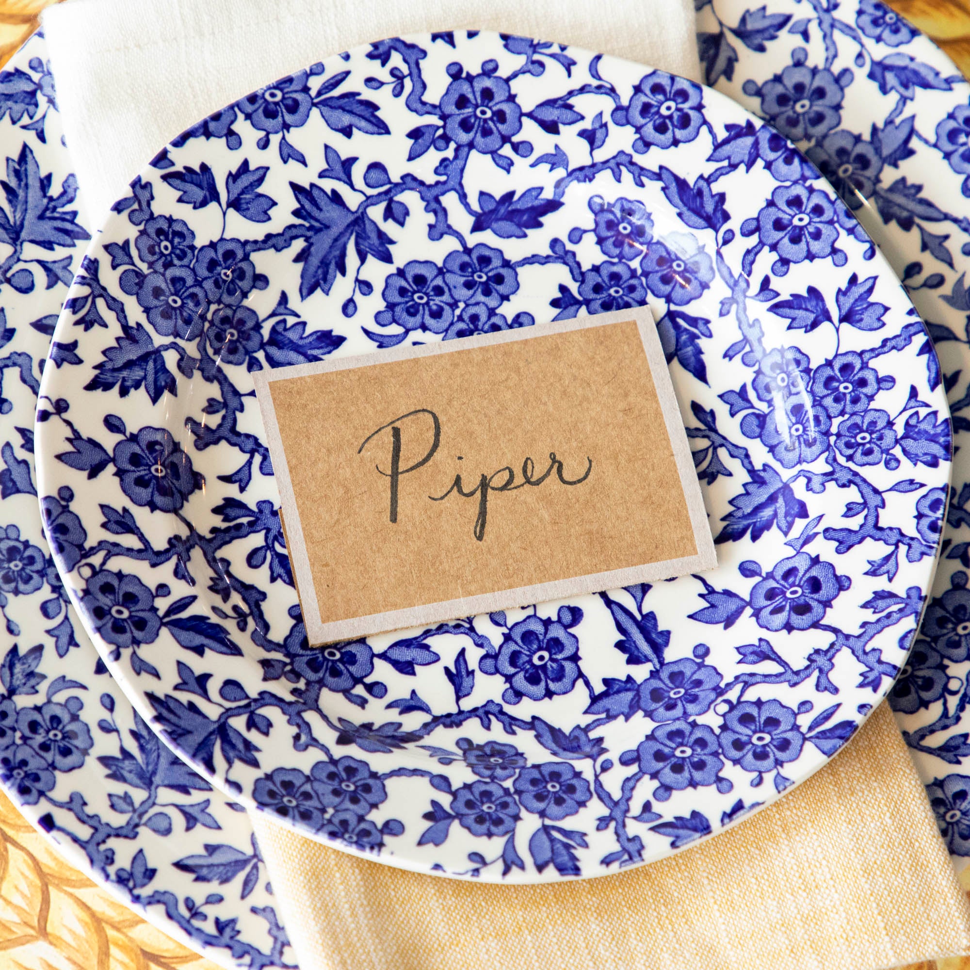 A Kraft White Frame Place Card by Hester & Cook is the perfect addition to any buffet table for guests.