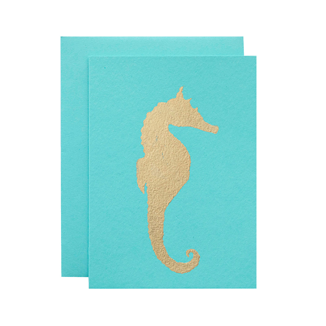 A turquoise-blue card with the silhouette of a seahorse in solid gold leaf.