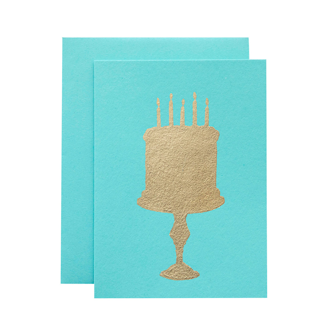 A turquoise-blue card with the silhouette of a birthday cake on a stand in solid gold leaf.