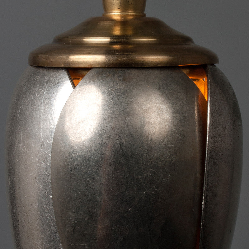 A single tulip-shaped pendant light made from vintage serving spoons.