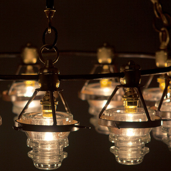 A close up of the insulator lights in the chandelier.