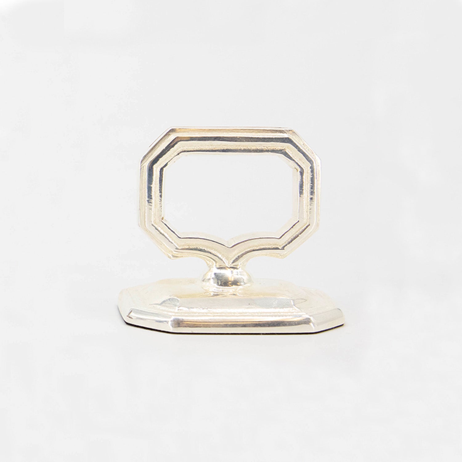 A silver vintage-style Napkin Ring with Place Card Holder on a white background.