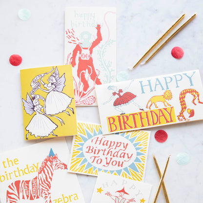A colorful Happy Birthday Ballerina card with an image of a lion and a clown by Cambridge Imprint.