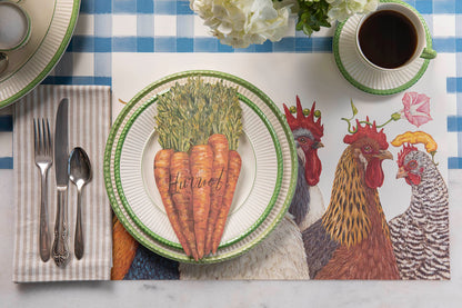 The Chicken Social Placemat under a charming place setting with a cup of coffee.