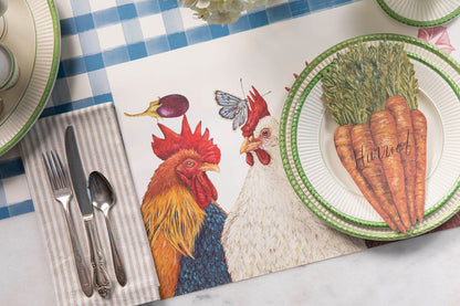 The Chicken Social Placemat under a charming place setting with the Carrot Table Accent.