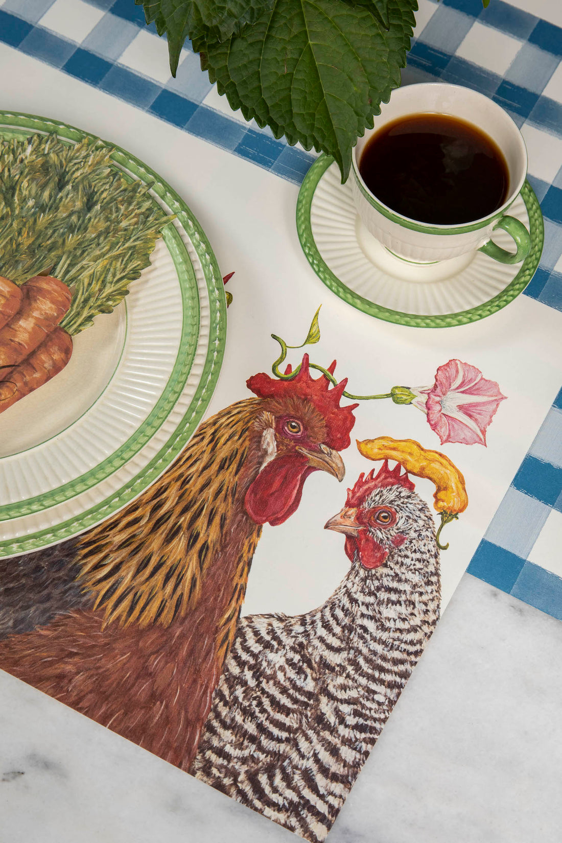 The Chicken Social Placemat under a charming place setting.