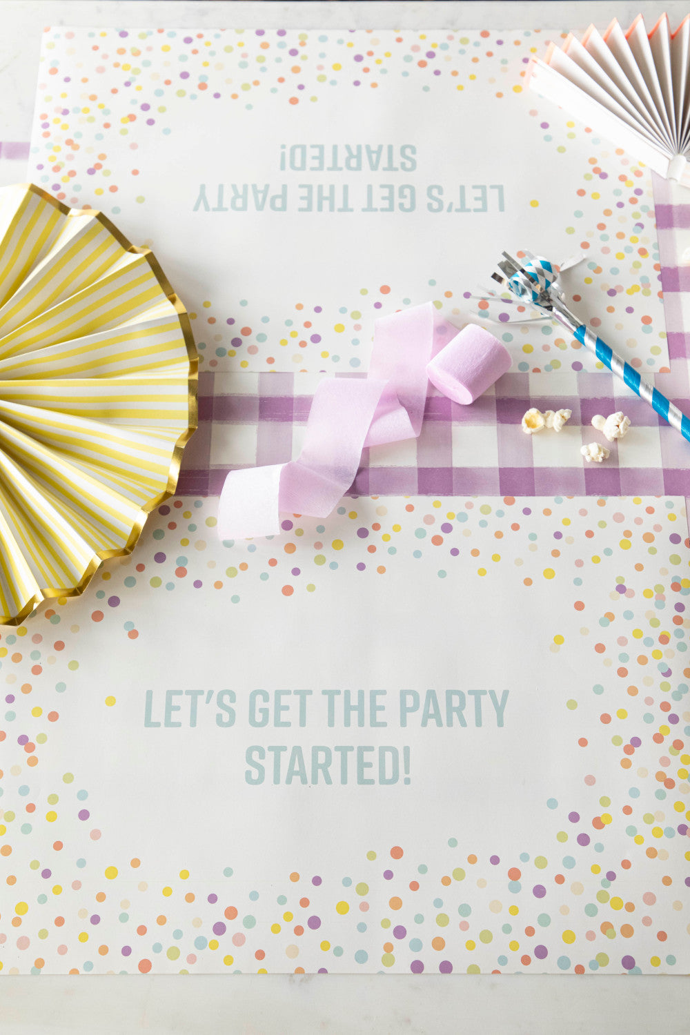 Table setting with Confetti Sprinkles Placemat with personalized message printed in sea foam color: "Let&