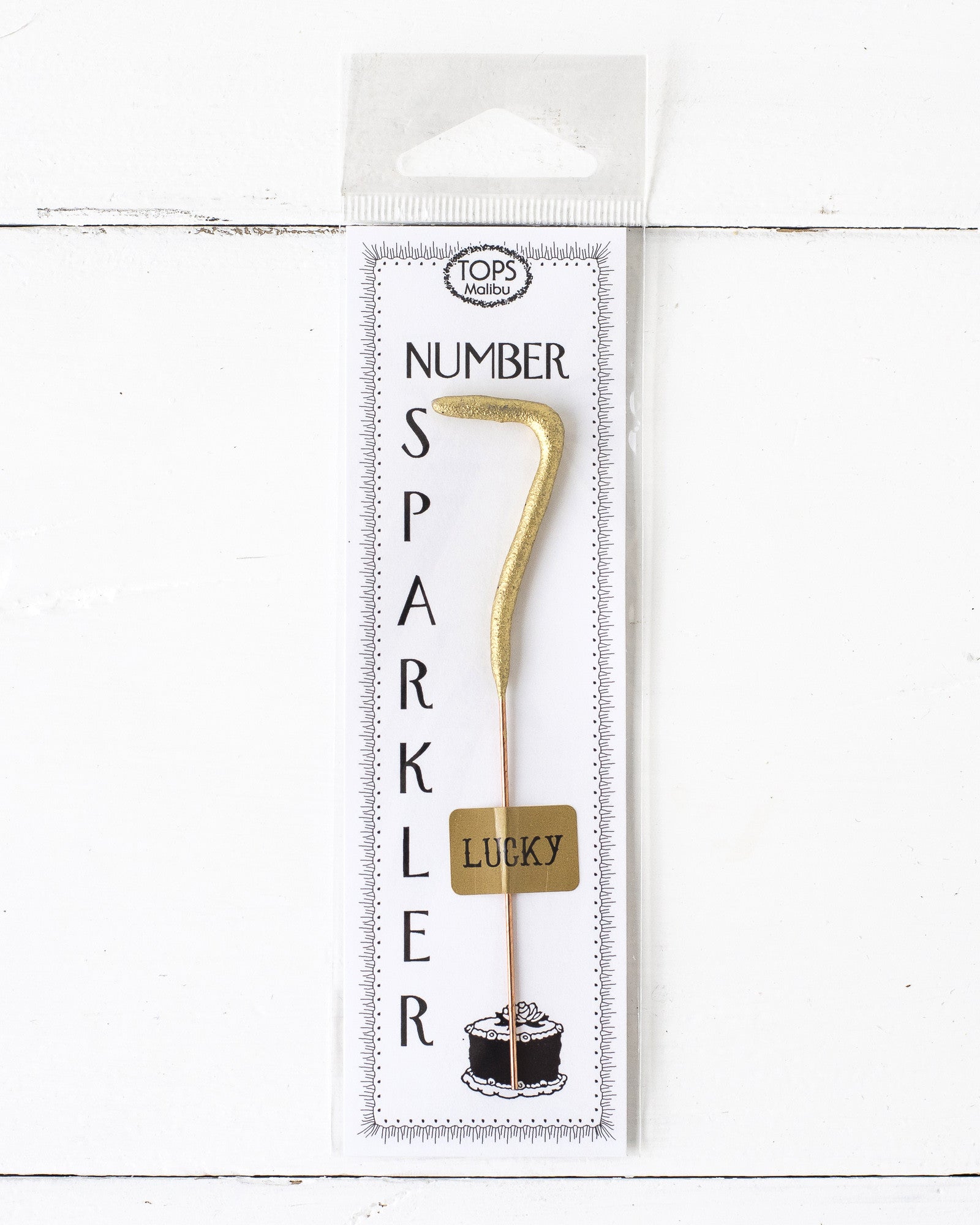 A 4" tall Gold Number Cake Topper Sparkler on a white background, manufactured by Tops Malibu.