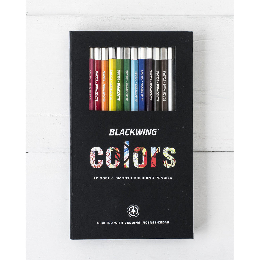 A set of 12 Blackwing Color Pencils with semi-hexagonal barrels, arrayed neatly in their packaging against a white background.
