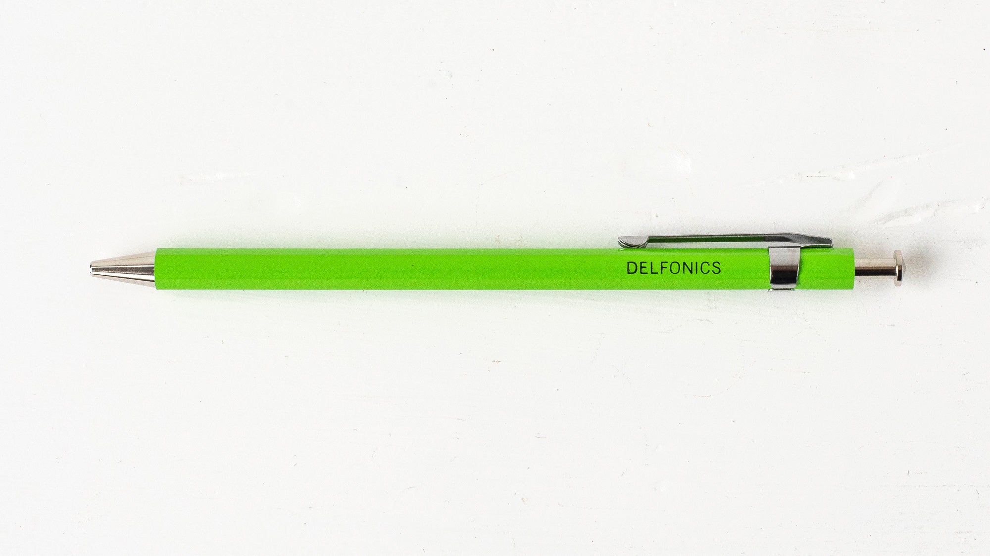 A green wooden ball pen with the brand name &