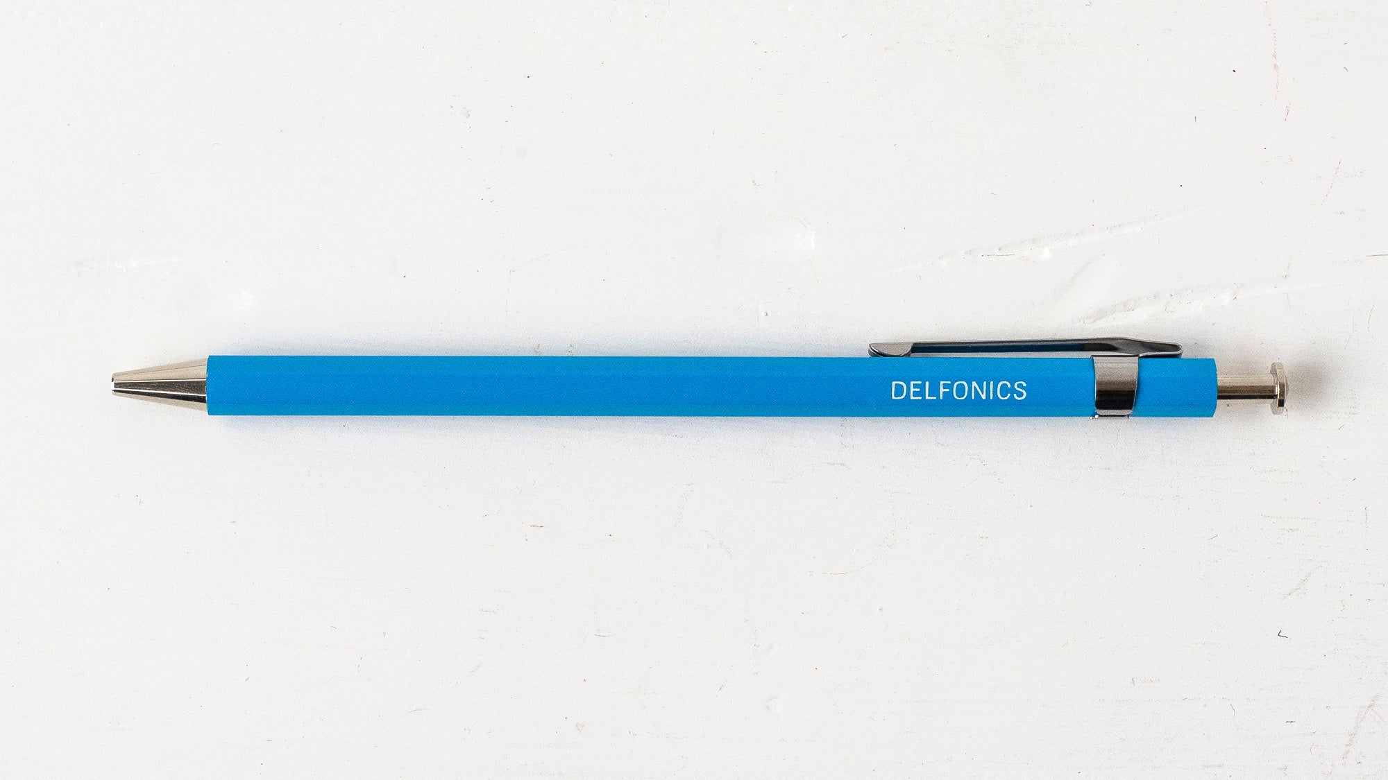 A sky blue wooden ball pen with the brand name &