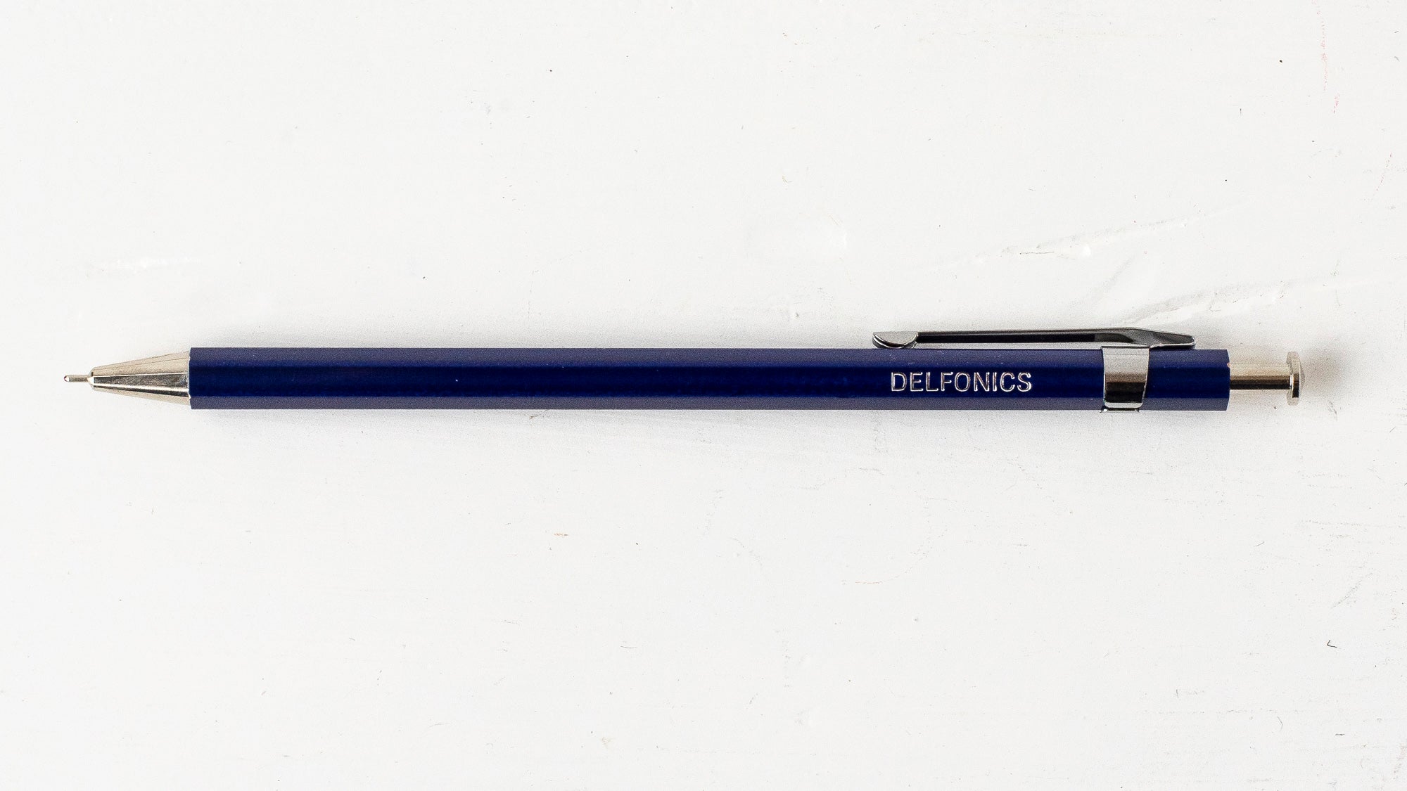 A blue wooden ball pen with the brand name &