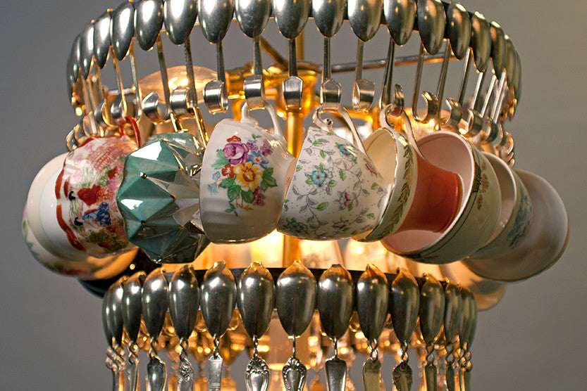 An unconventional Double Teacup chandelier made from suspended silverware and vintage teacups by Hester & Cook.