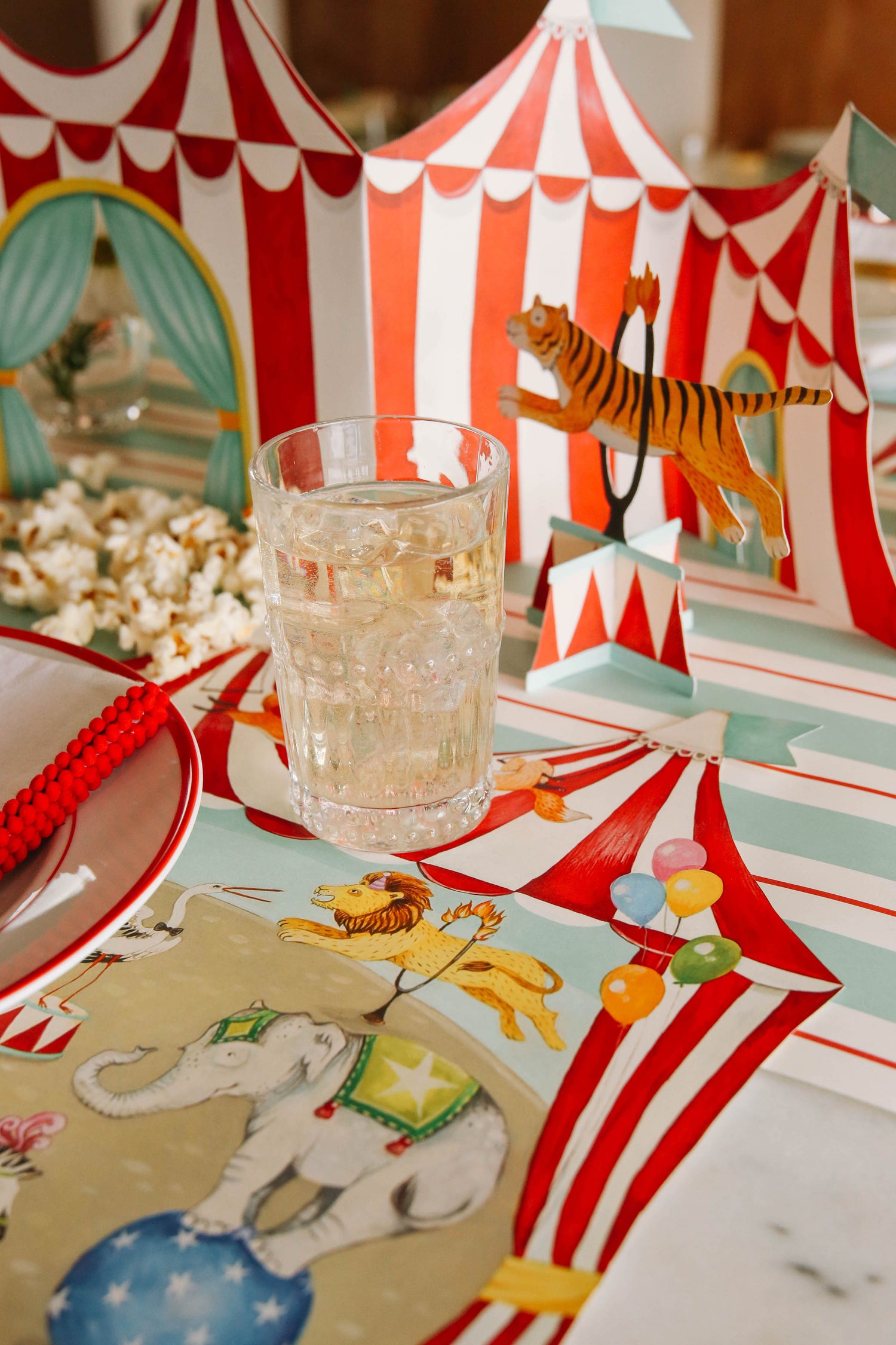 A circus-themed tablescape featuring the Circus Trio Table Ornaments.