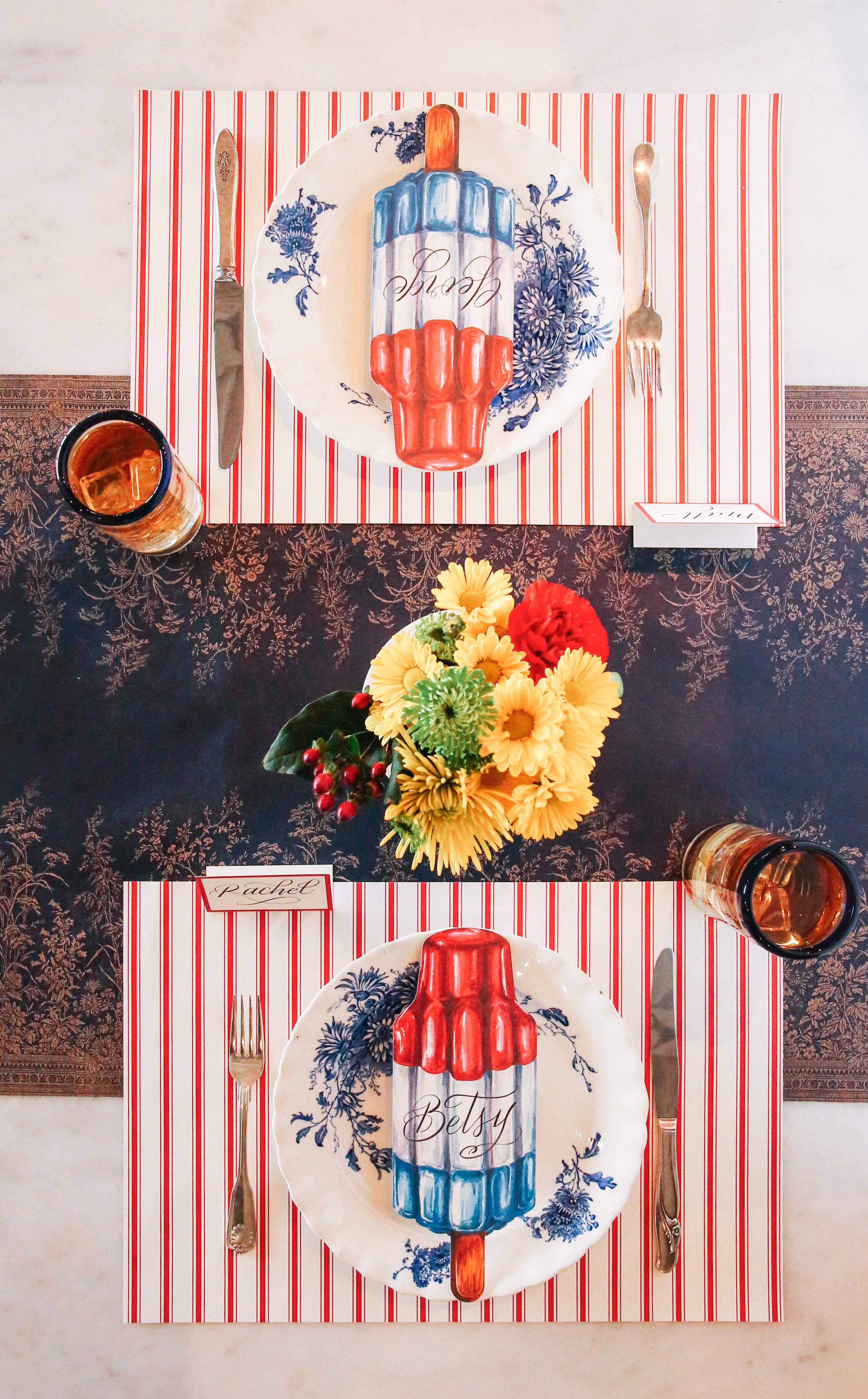 The Red Ribbon Stripe Placemat under a patriotic table setting for two, from above.