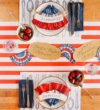 A patriotic table setting for two, featuring the Die-cut Star-Spangled Placemat folded to a quarter-size as a plate accent.