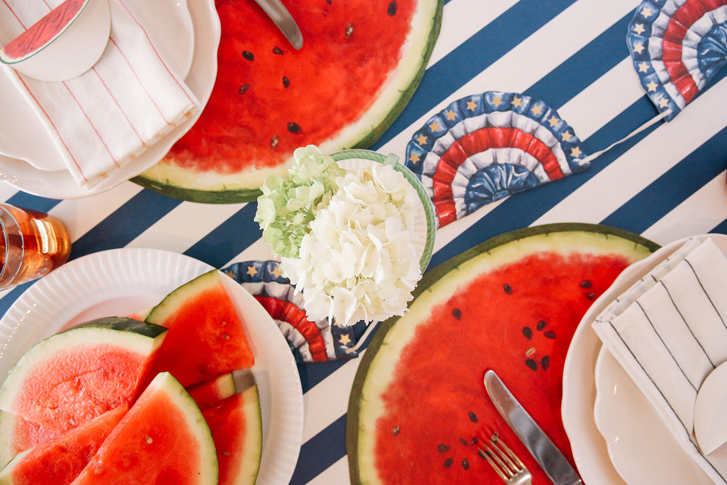 The Die-cut Watermelon Placemat under an elegant summertime table setting.