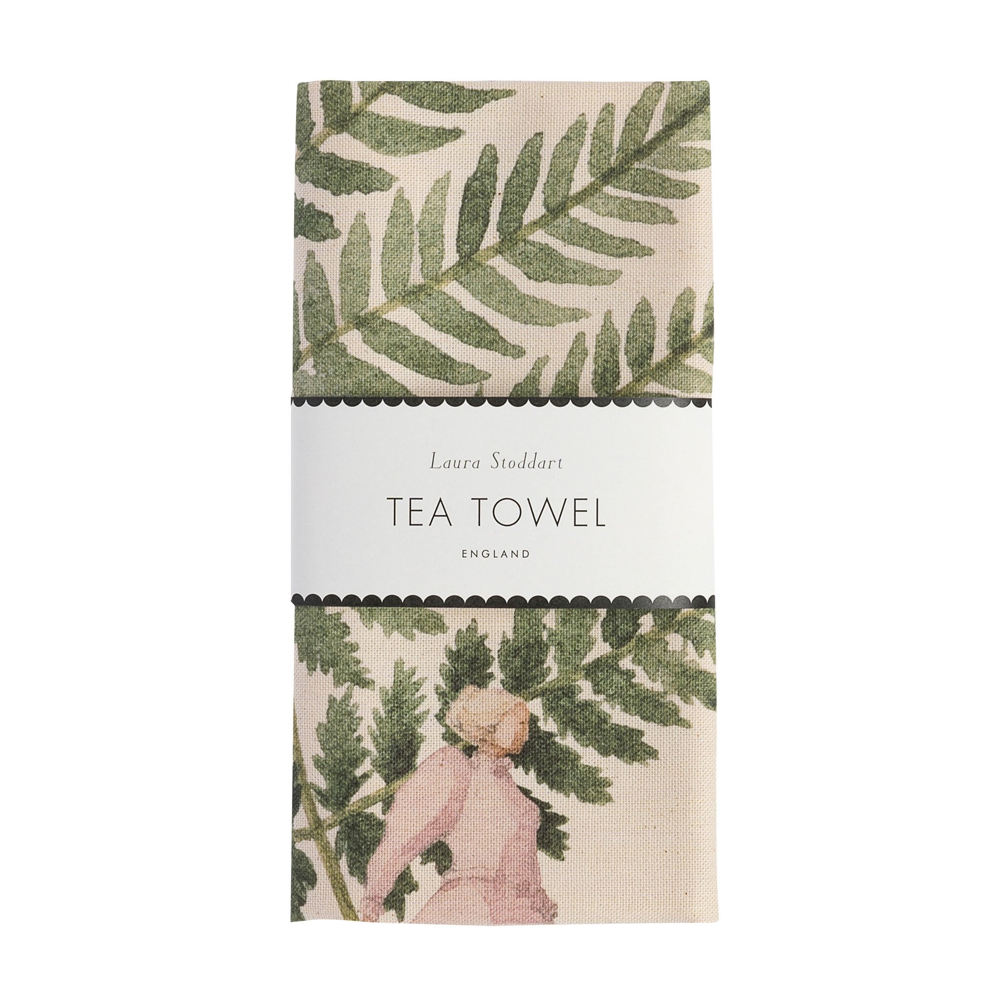 The Single Fern Tea Towel in retail packaging, folded neatly wrapped with a white paper belly band.