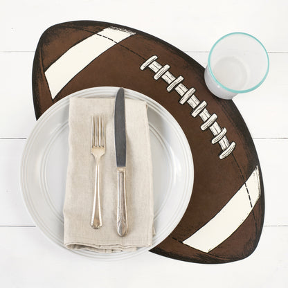 A Die-cut Football Placemat under a football-themed place setting.