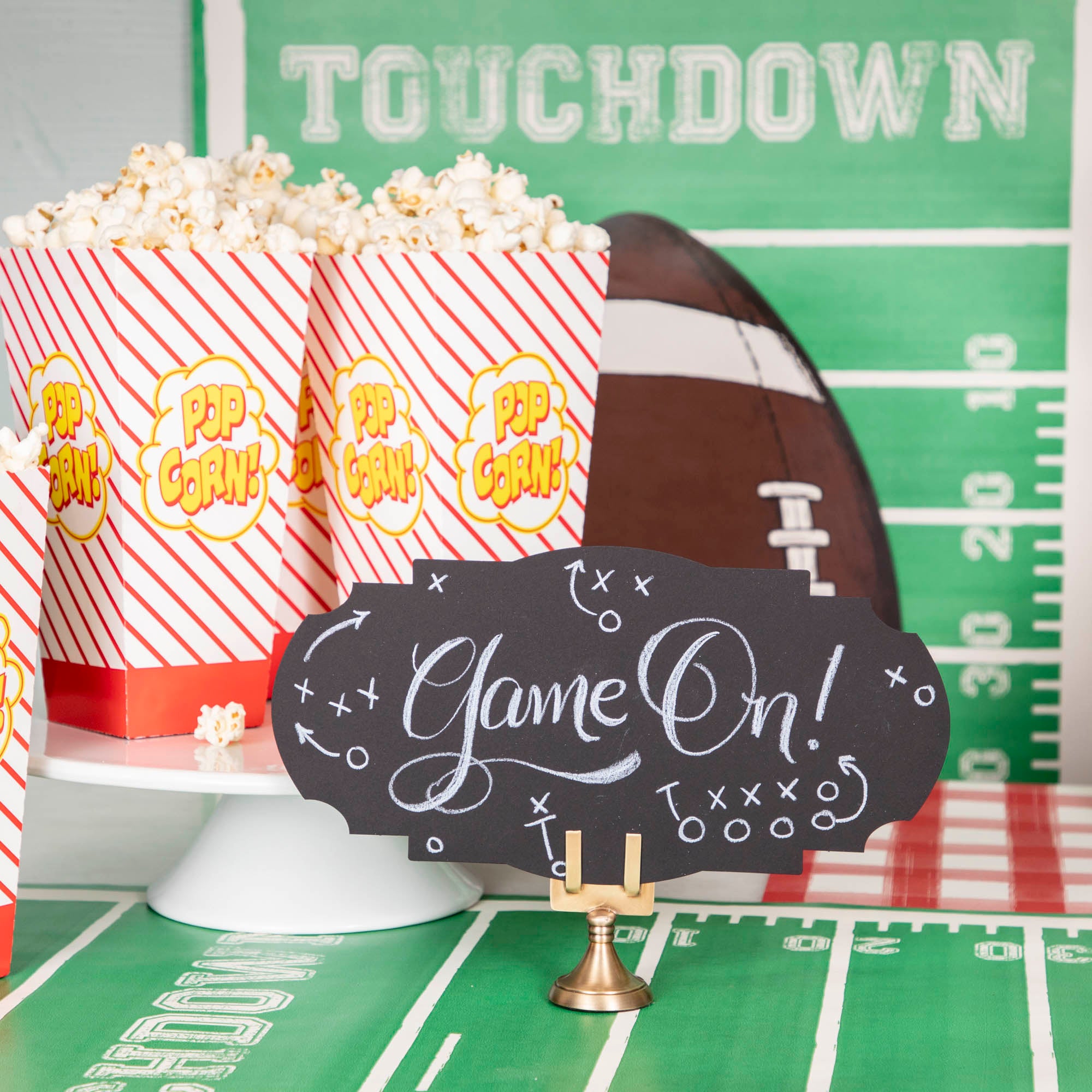 The Touchdown Runner used as a wall paper and table runner for a game day spread.