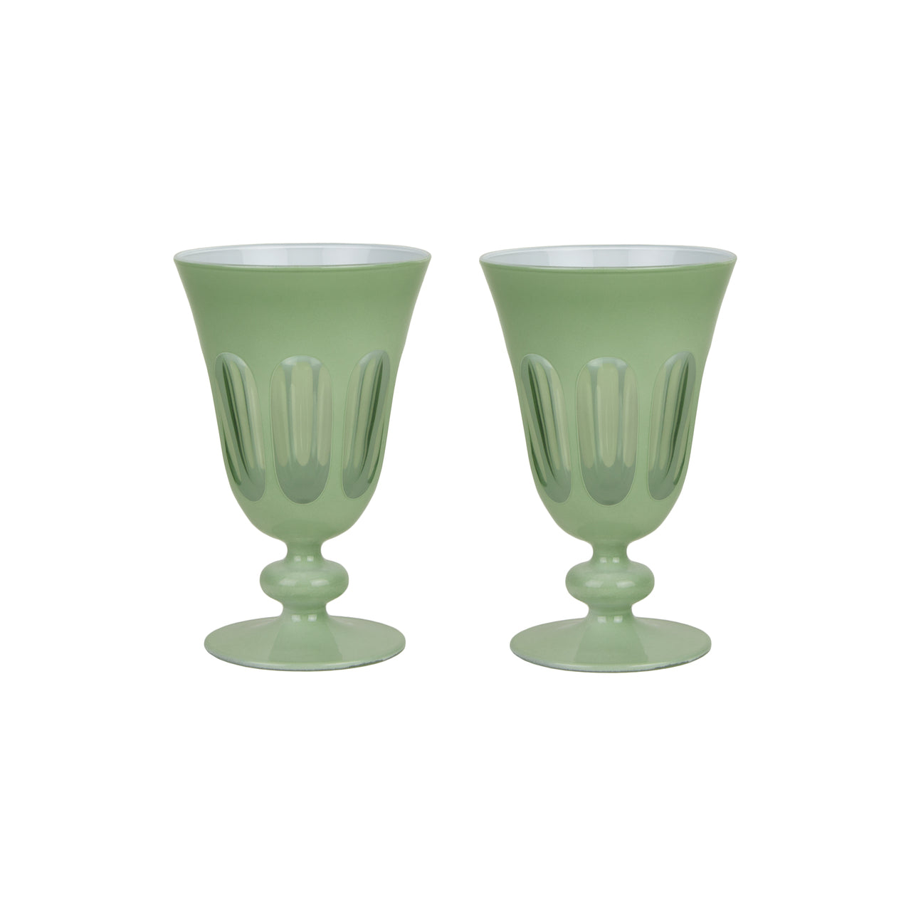 A set of SIR/MADAM Rialto Pale Sage Glasses and a bowl on a marble table.