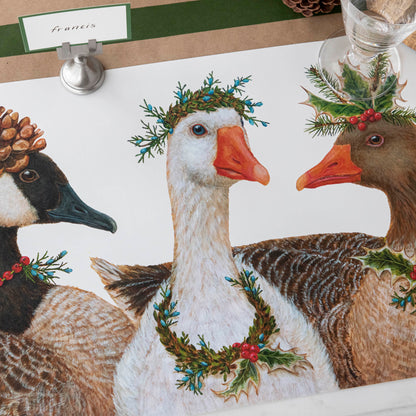 Close-up of the Festive Geese Placemat on a festive winter-themed table.