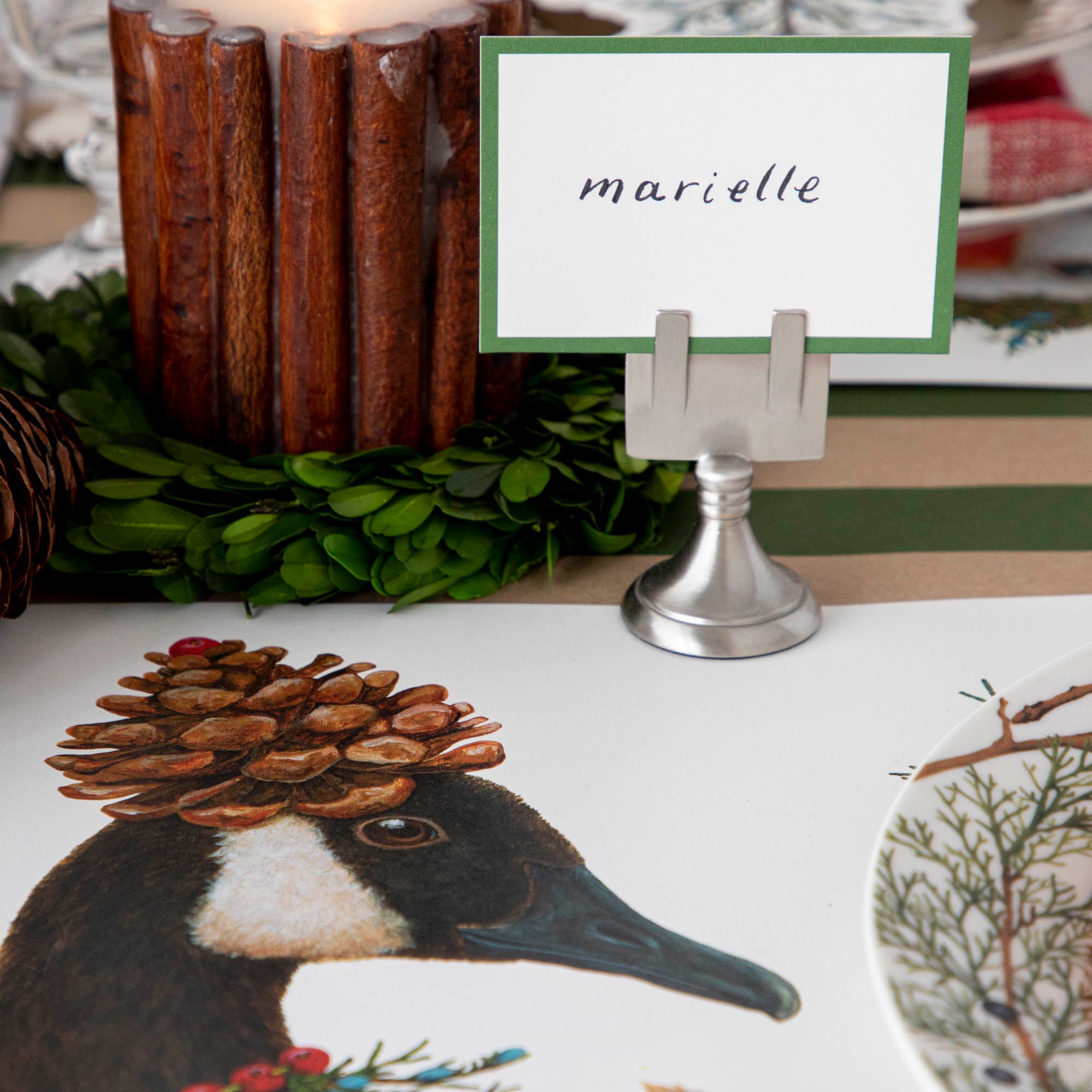 Close-up of the Festive Geese Placemat on a winter-themed table setting, showing a goose&