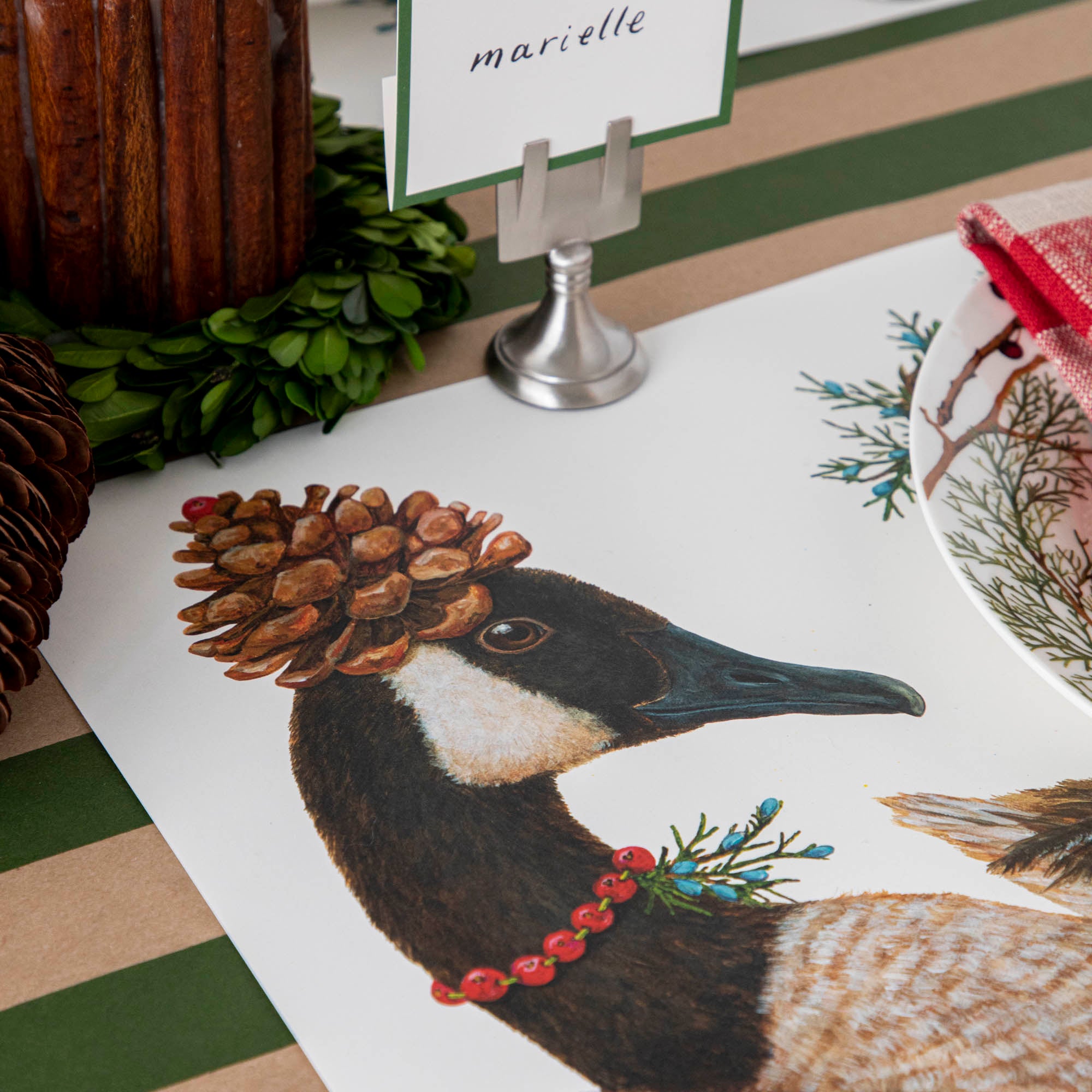 Close-up of the Festive Geese Placemat on a winter-themed table setting, showing a goose&
