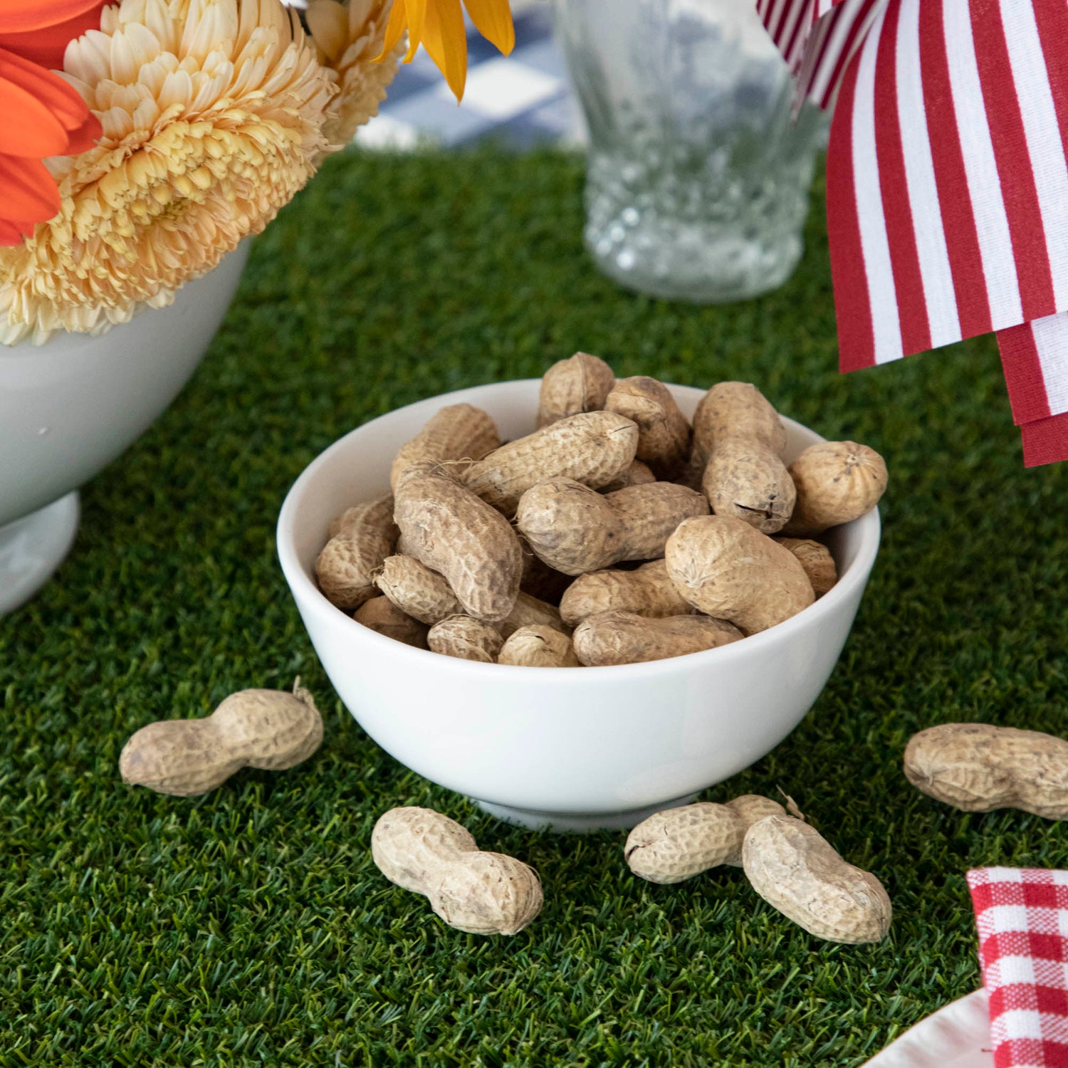Peanuts on a Talking Tables Artificial Grass Table Runner.