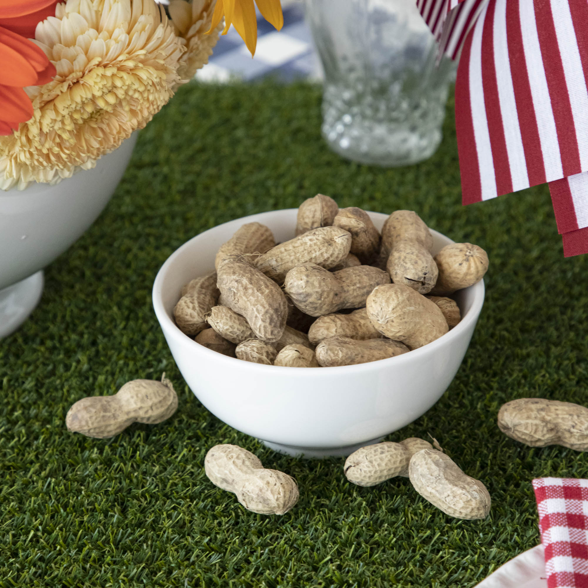 Peanuts on a Talking Tables Artificial Grass Table Runner.
