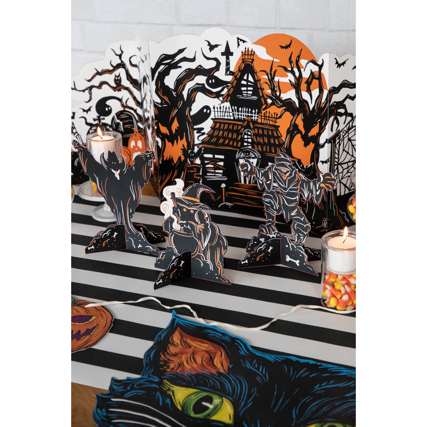 Three Monster Mash Table Ornaments, depicting spooky creatures, on a white background by Hester & Cook.