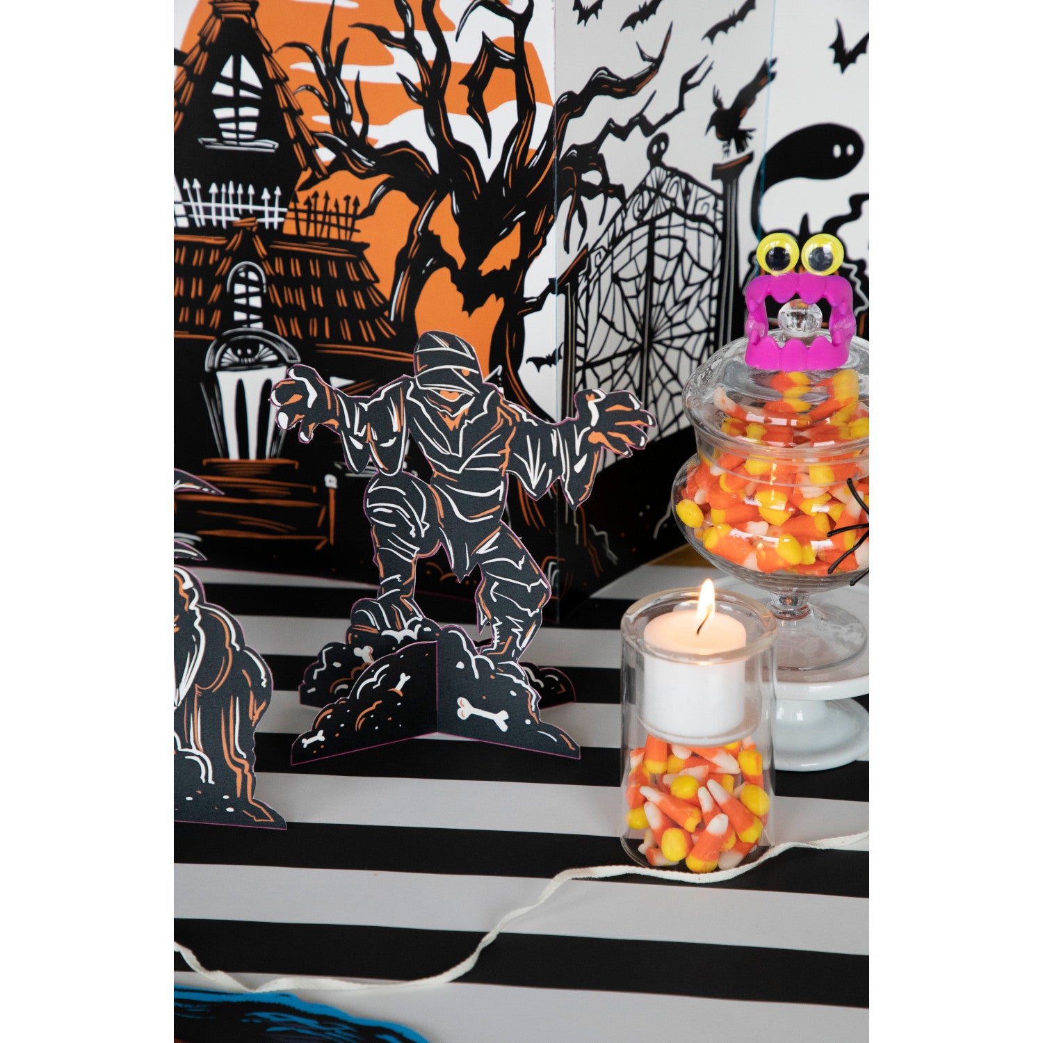 Three Monster Mash Table Ornaments, depicting spooky creatures, on a white background by Hester & Cook.